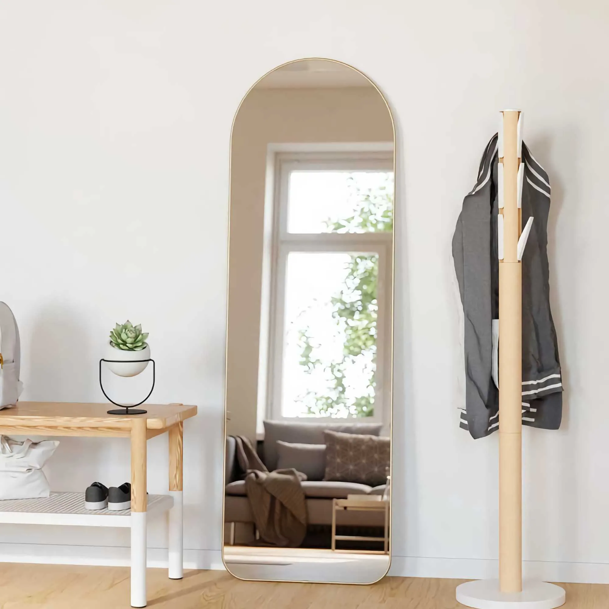Umbra Hubba arched leaning mirror, brass